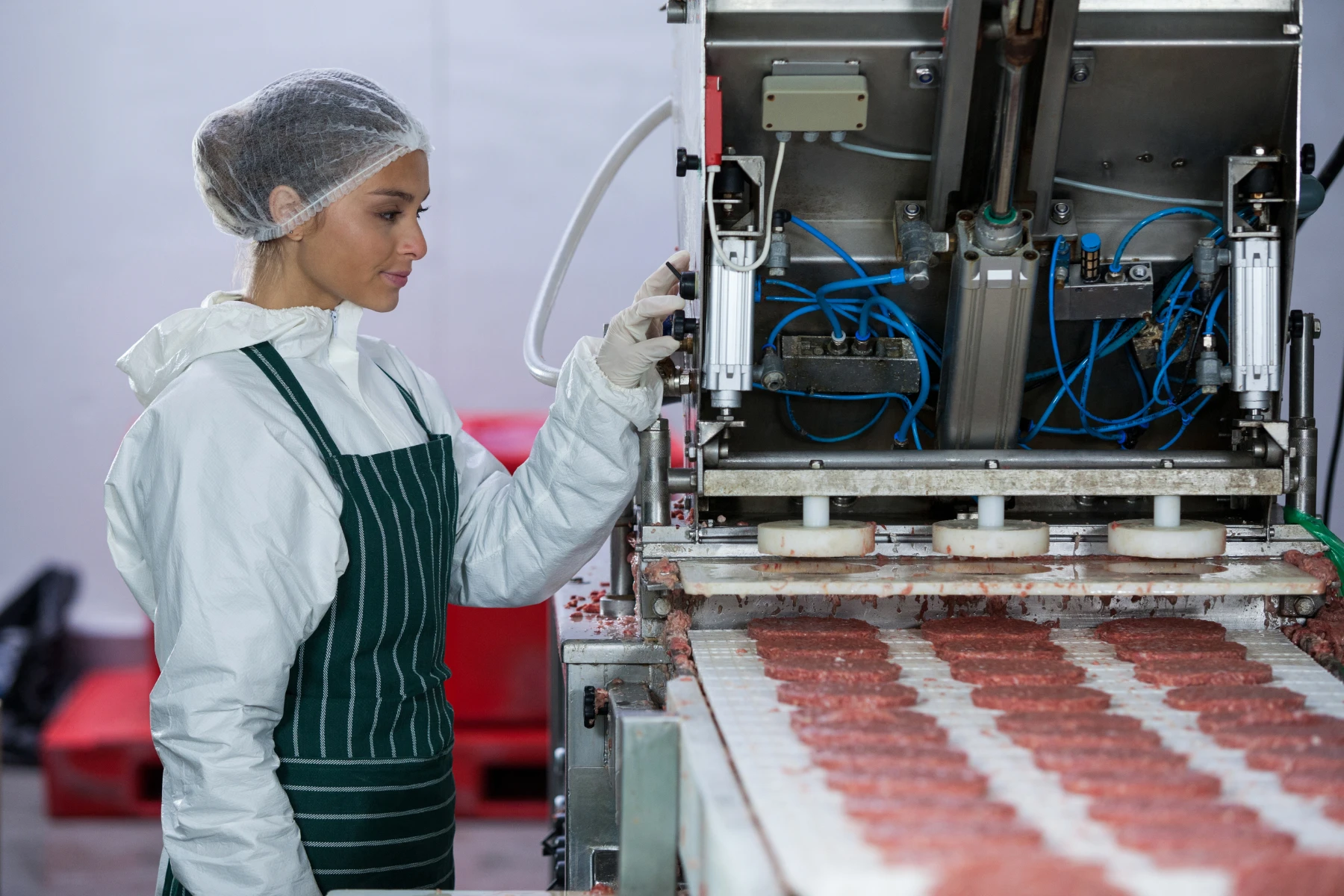 woman-operating-food-processing-machine-in-factory-2026-01-09-11-32-01-utc
